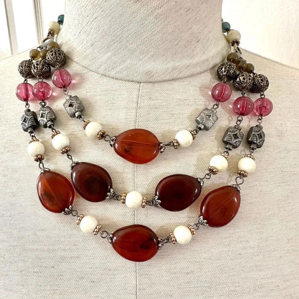 Silver tone multi tier beaded statement necklace